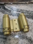1 Parker Double Action Spring Hinge Polished Brass,,(dan). Fixed Price $50.00.